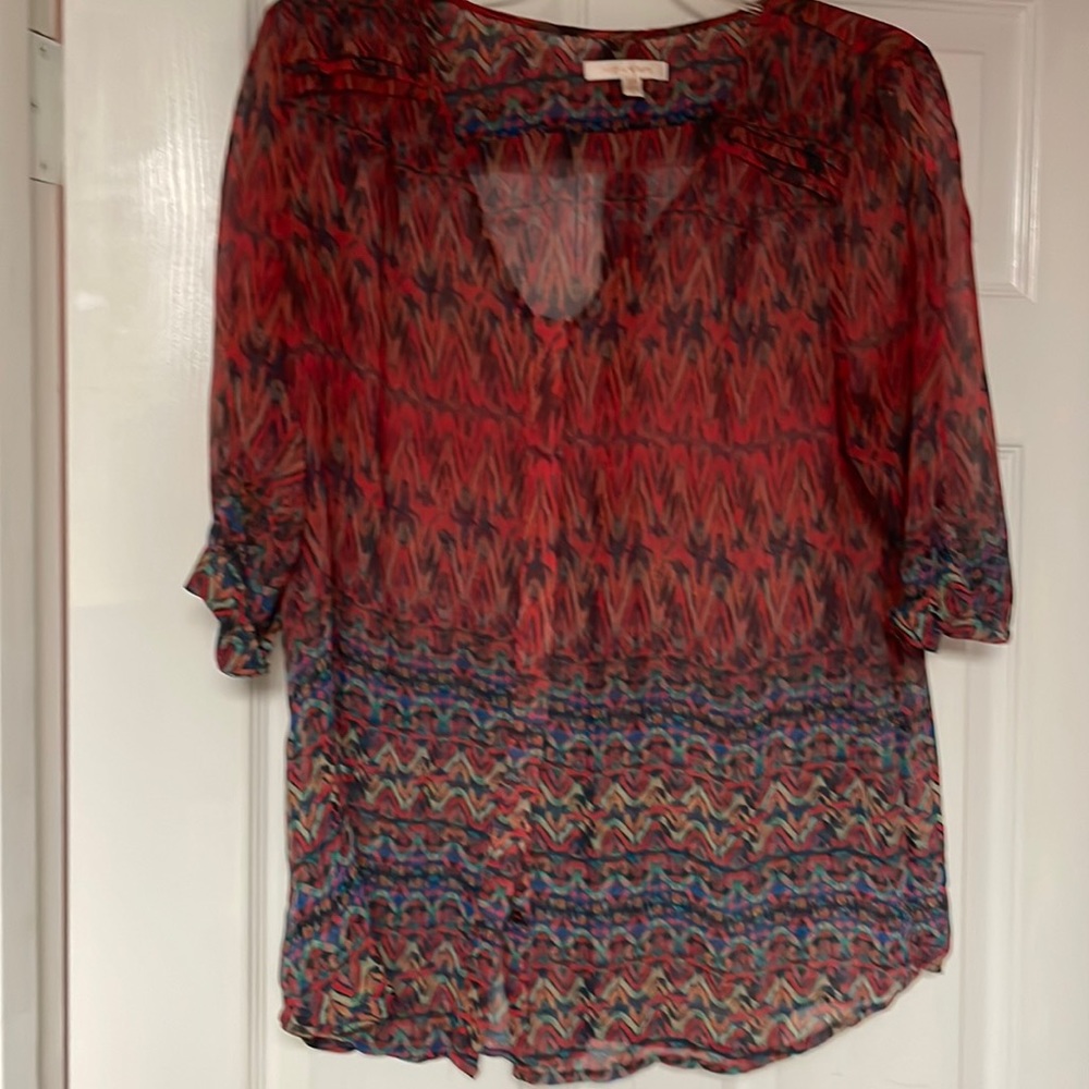 Long sheer top with accompanying navy tank top